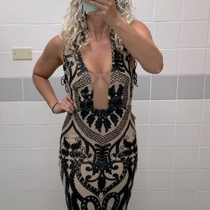 Long Sequin Cream & Black dress. Deep Neckline. Very fitting to body.